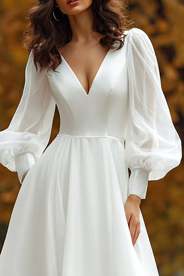 Robe de mariée à manches longues à col en V ivoire